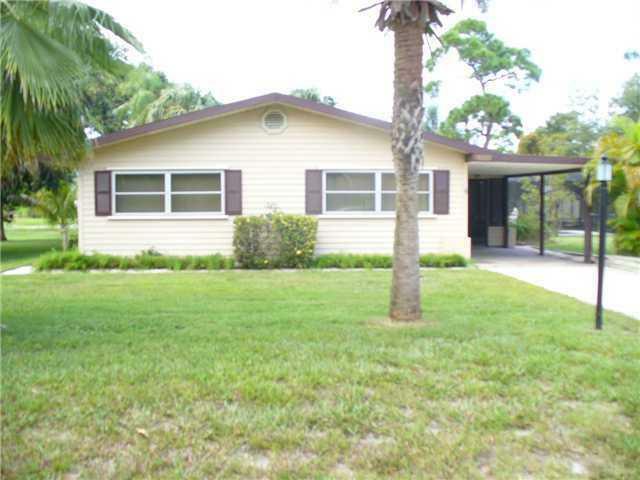 Property Photo: 10897 SE Hobart Street FL 33469