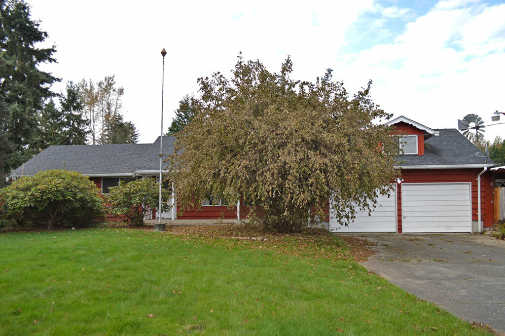 Property Photo:  12002 Woodland Ave E  WA 98373 