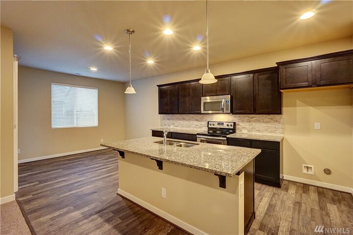 Property Photo: 9093 Aster Street SE 105 WA 98501