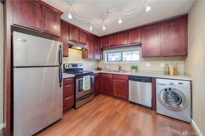 Property Photo:  23417 16th Ave S B-302  WA 98198 