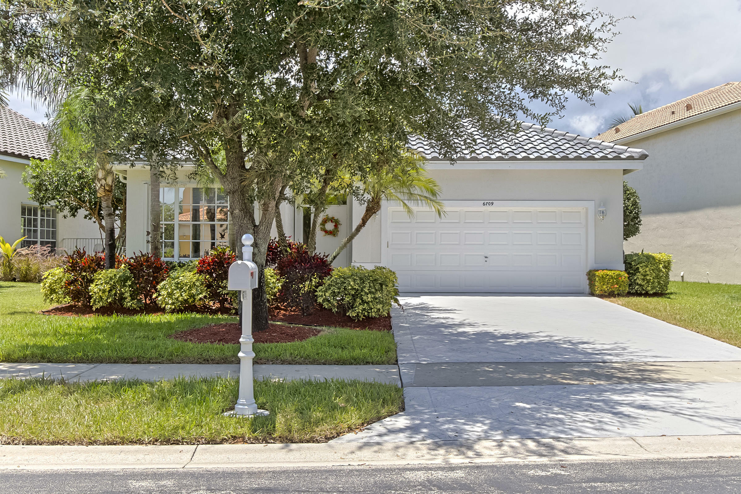 Property Photo:  6709 Remington Place  FL 33463 