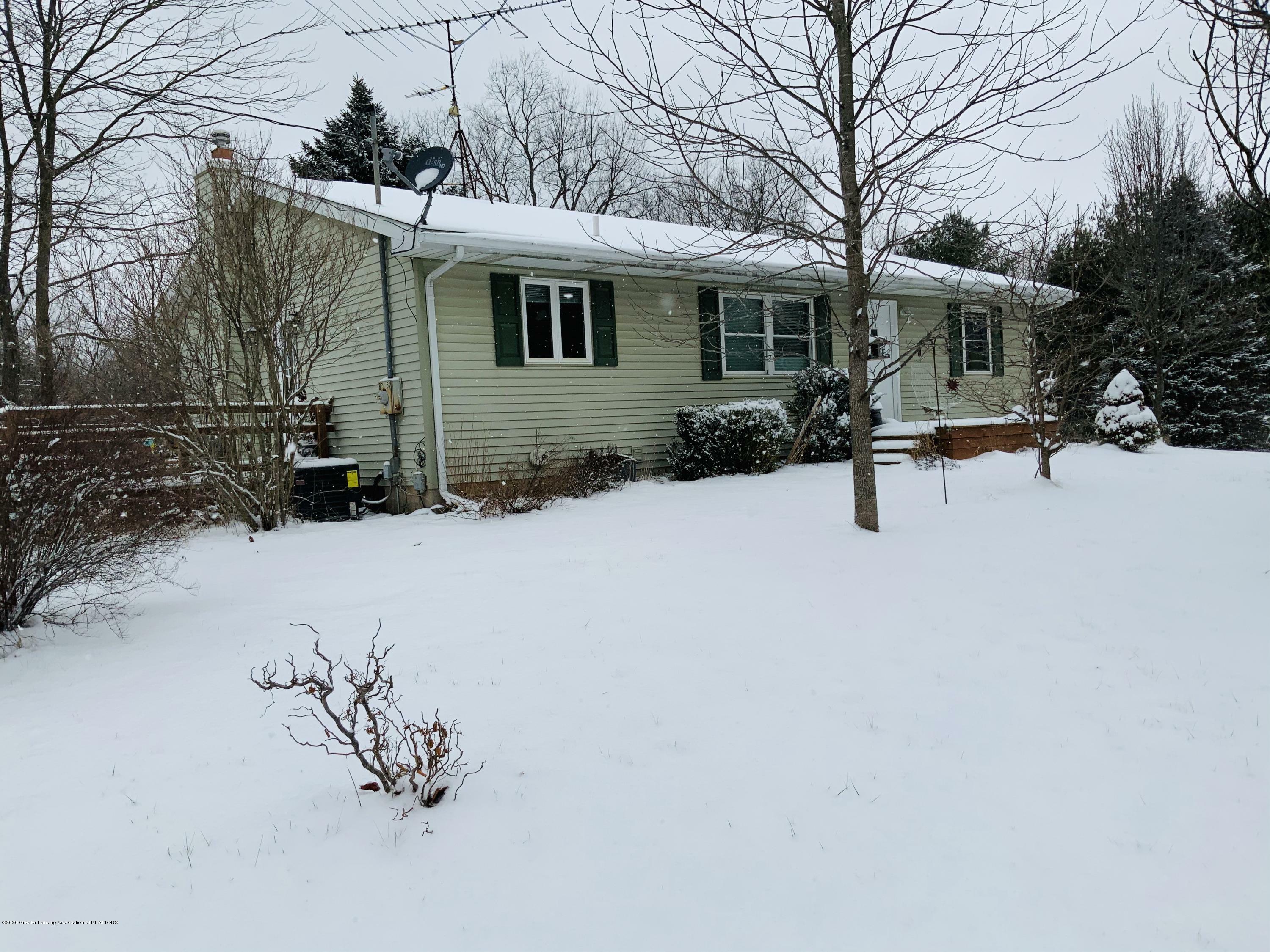 Property Photo:  8752 Colby Lake Road  MI 48848 