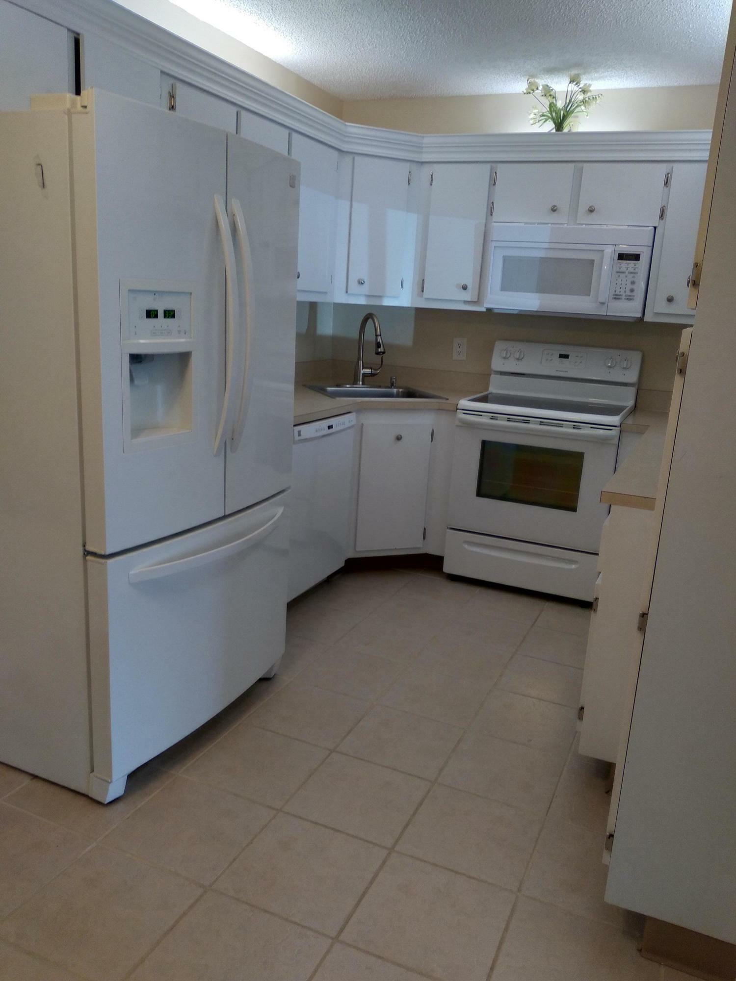 Property Photo:  820 Sky Pine Way C1  FL 33415 