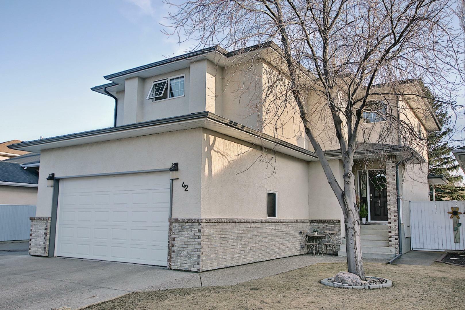 Property Photo: 42 Uplands Boulevard N AB T1H 6J4