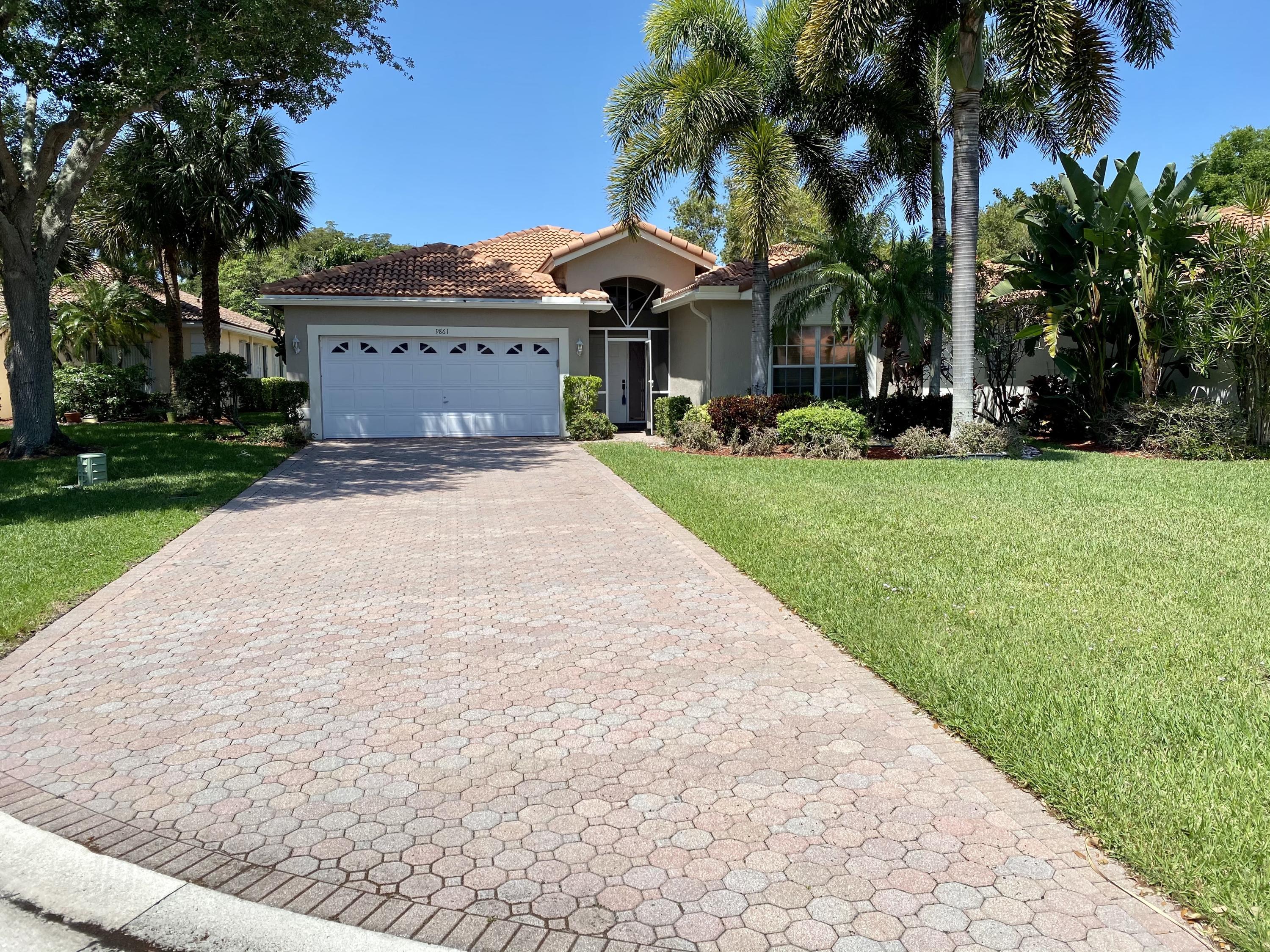 Property Photo: 9861 Lemonwood Way FL 33437