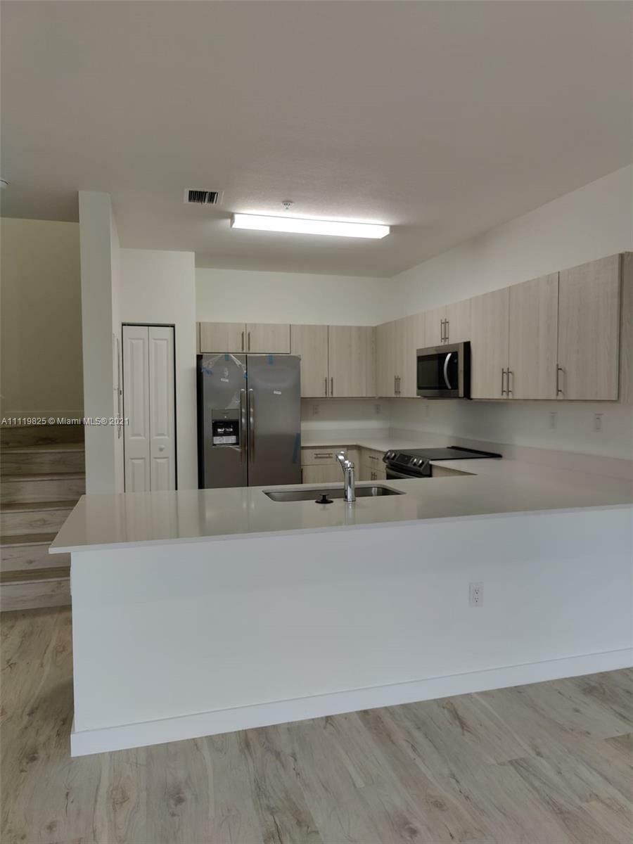 Property Photo:  15540 SW 136 St 4-216  FL 33196 