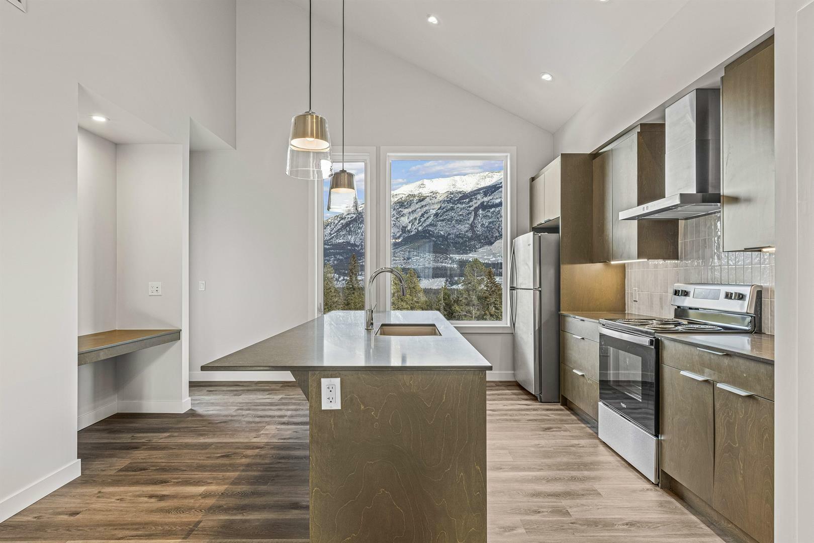 Property Photo: 18, 209 Stewart Creek Rise 18 AB T1W0G6