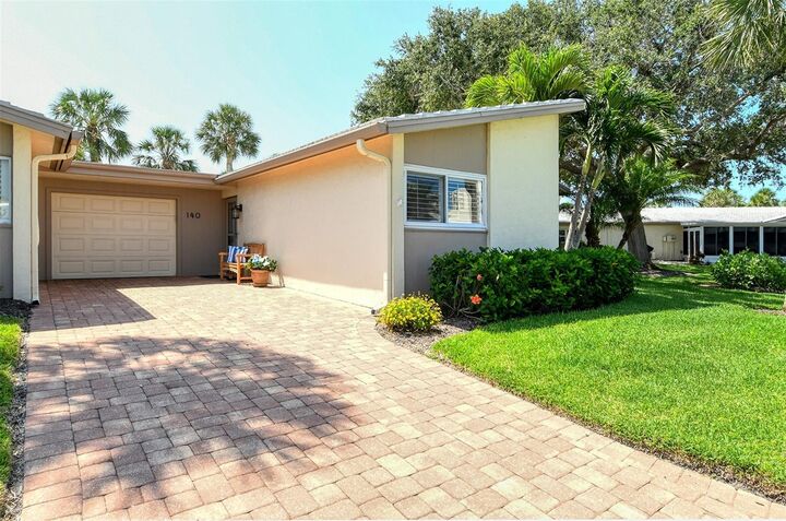 Property Photo:  140 Whispering Sands Drive V-40  FL 34242 