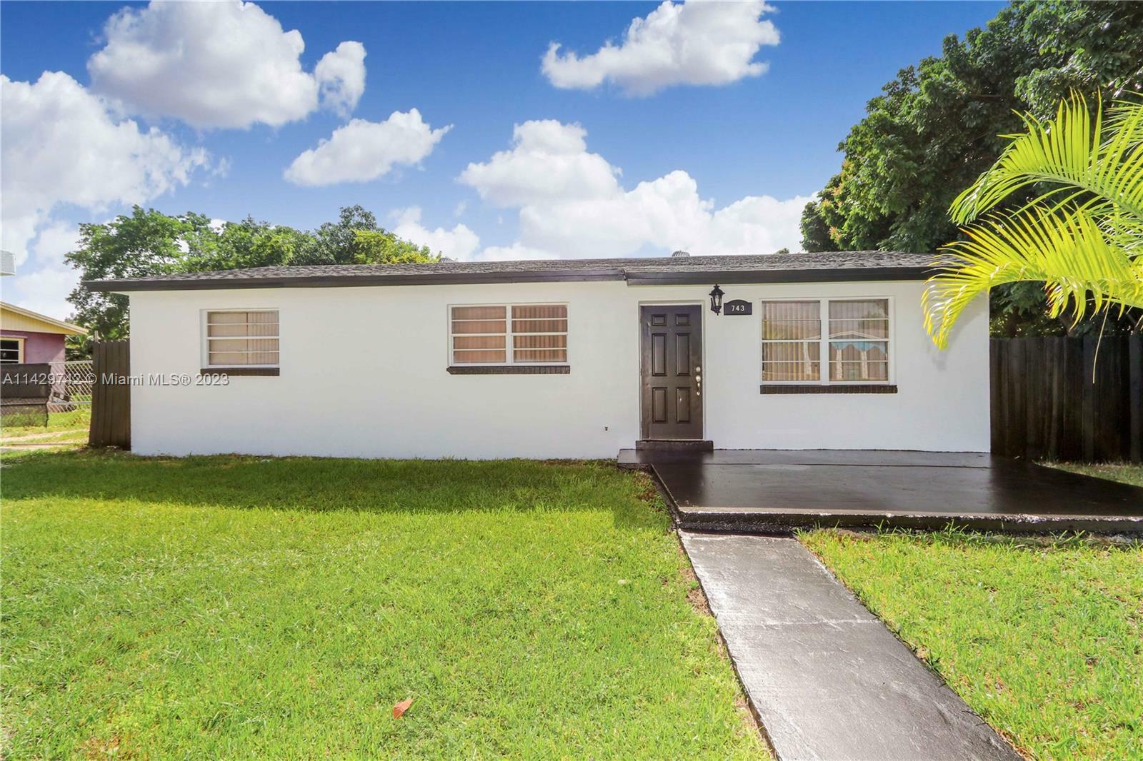 Property Photo:  743 NW 7th Ave  FL 33034 