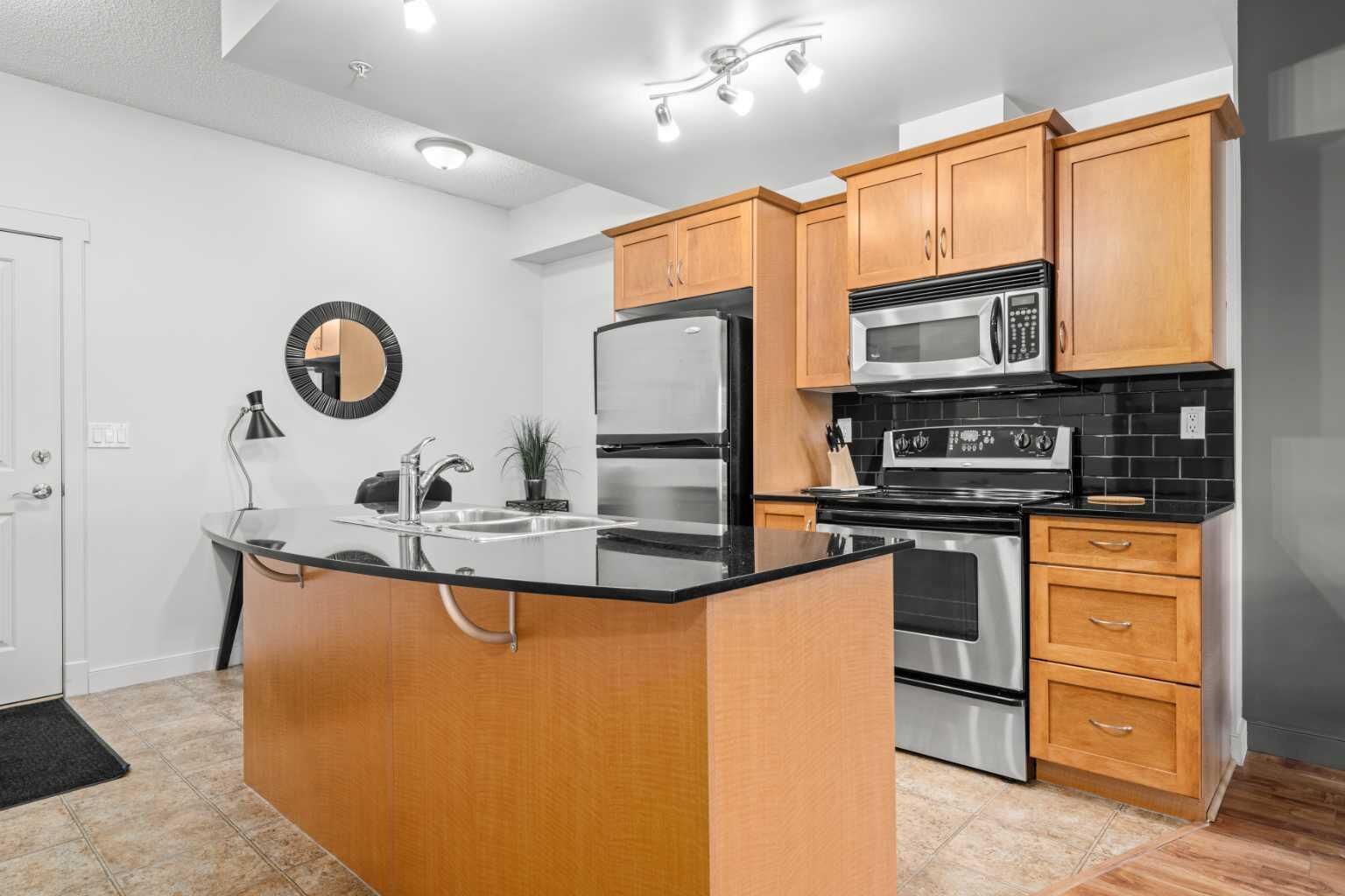 Property Photo: 3412, 11811 Lake Fraser Drive SE 3412 AB T2J 7J1