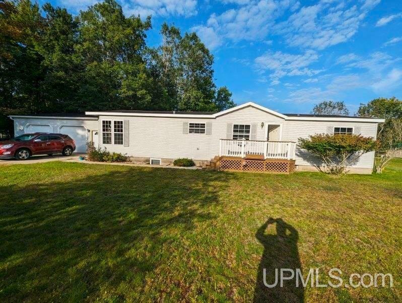 Property Photo:  50 Tipperary  MI 49837 