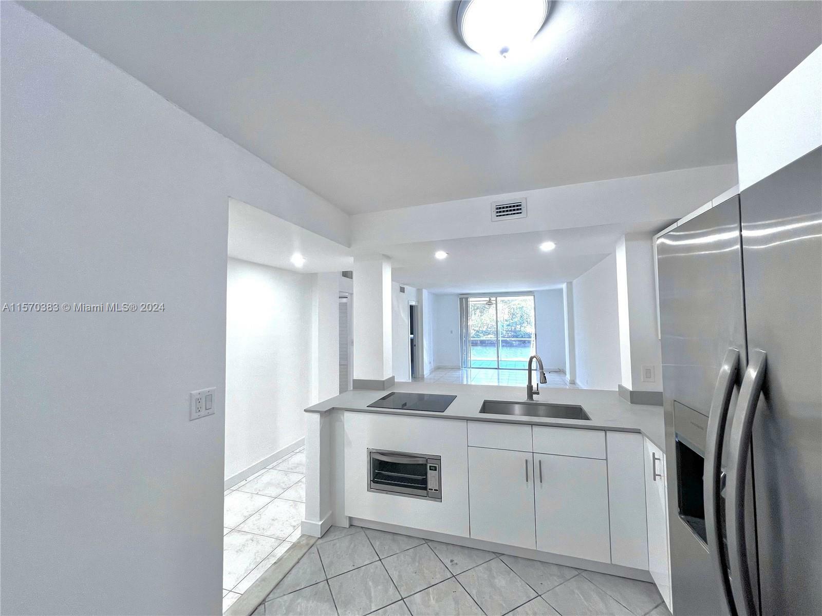 Property Photo:  3660 NE 166th St 114  FL 33160 