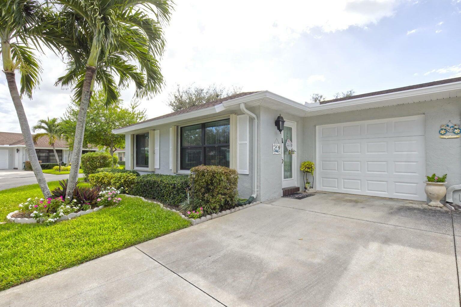 Property Photo:  9820 Tabebuia Tree Drive A  FL 33436 