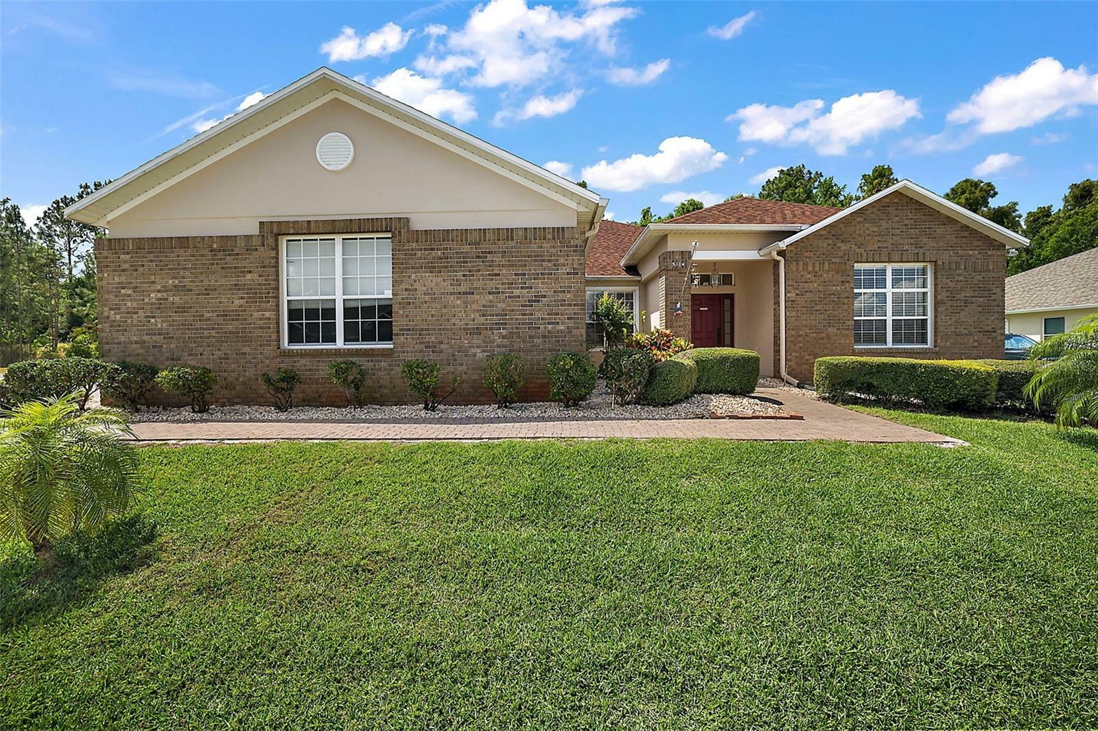 Property Photo:  5614 Windsong Oak Drive  FL 34748 