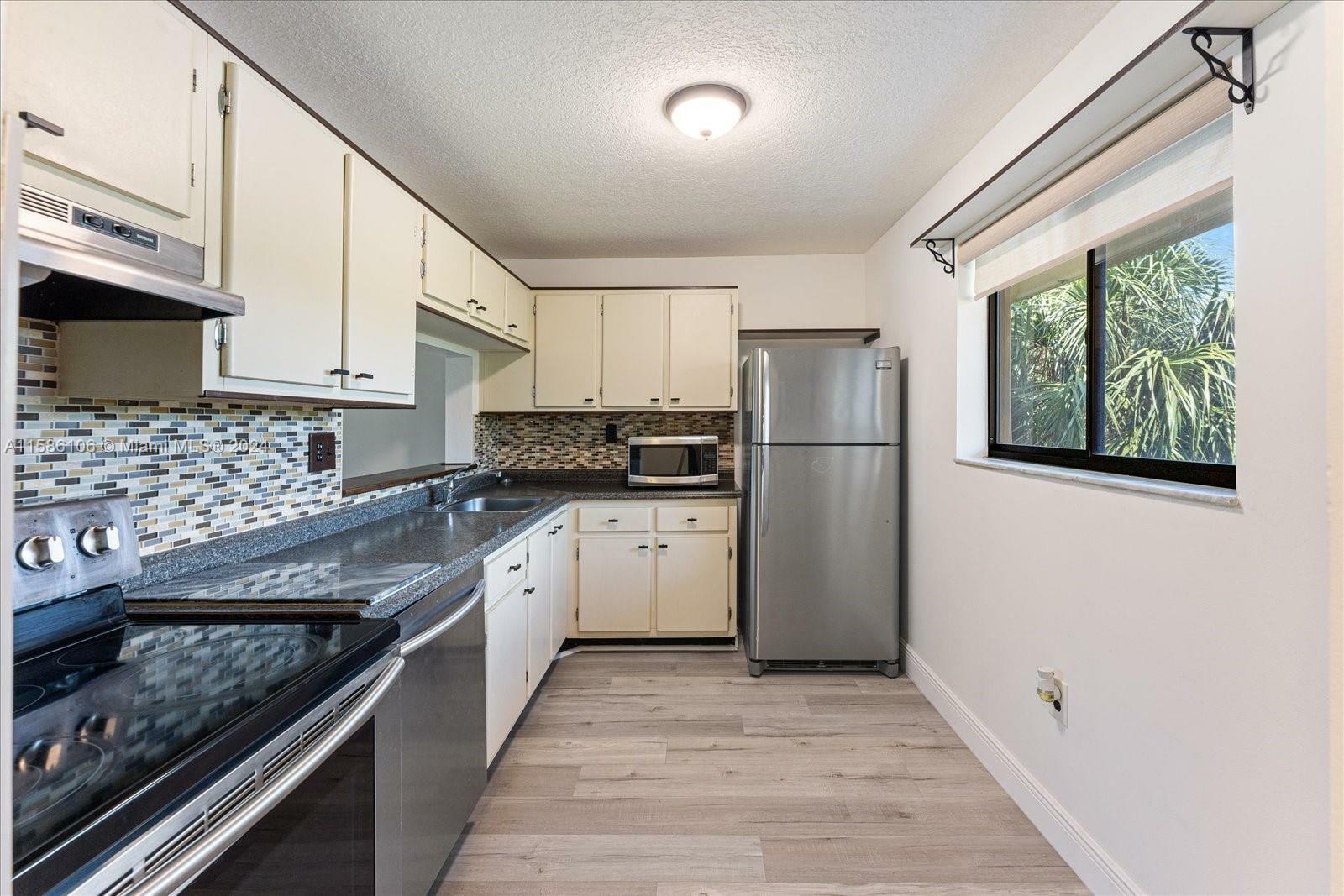 Property Photo:  8415 SW 107th Ave 335W  FL 33173 