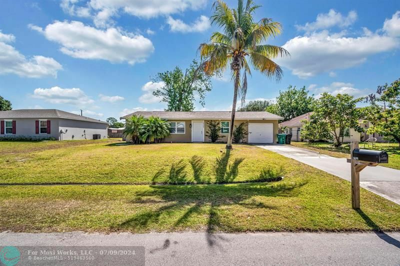 Property Photo:  1721 SW Angelo St  FL 34953 