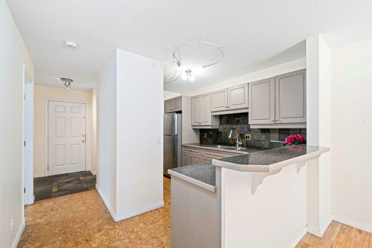 Property Photo:  705 56 Avenue SW 102  AB T2V 0G9 