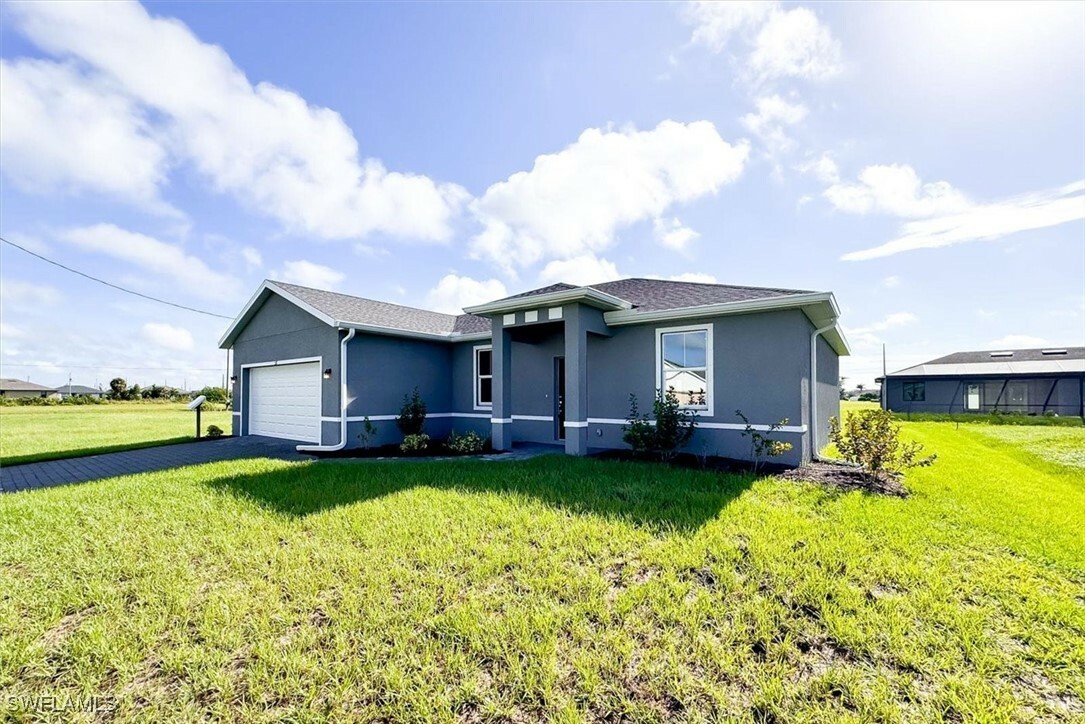 Property Photo:  521 NW 25th Avenue  FL 33993 