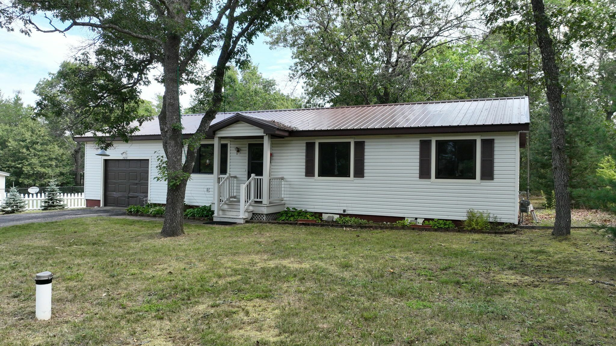 Property Photo:  7215 Tuscarora Circle  MI 49749 