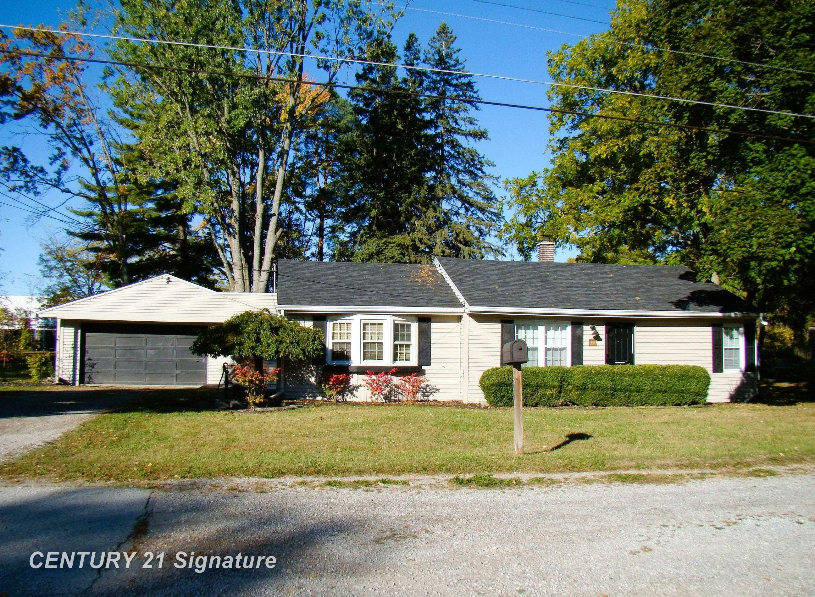 Property Photo:  201 Harrison Drive  MI 48609 