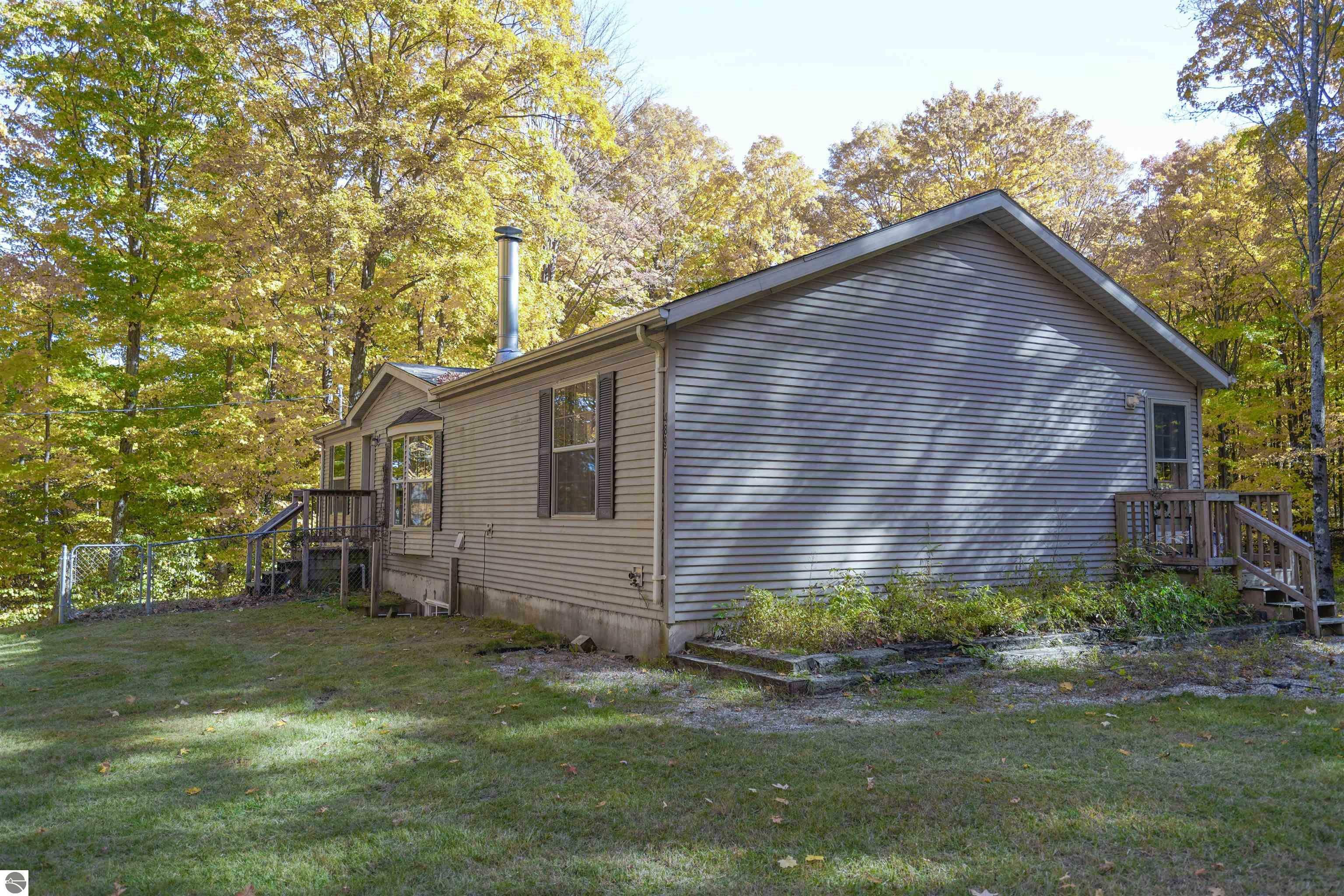 Property Photo:  4897 Woodman Road, SW  MI 49680 