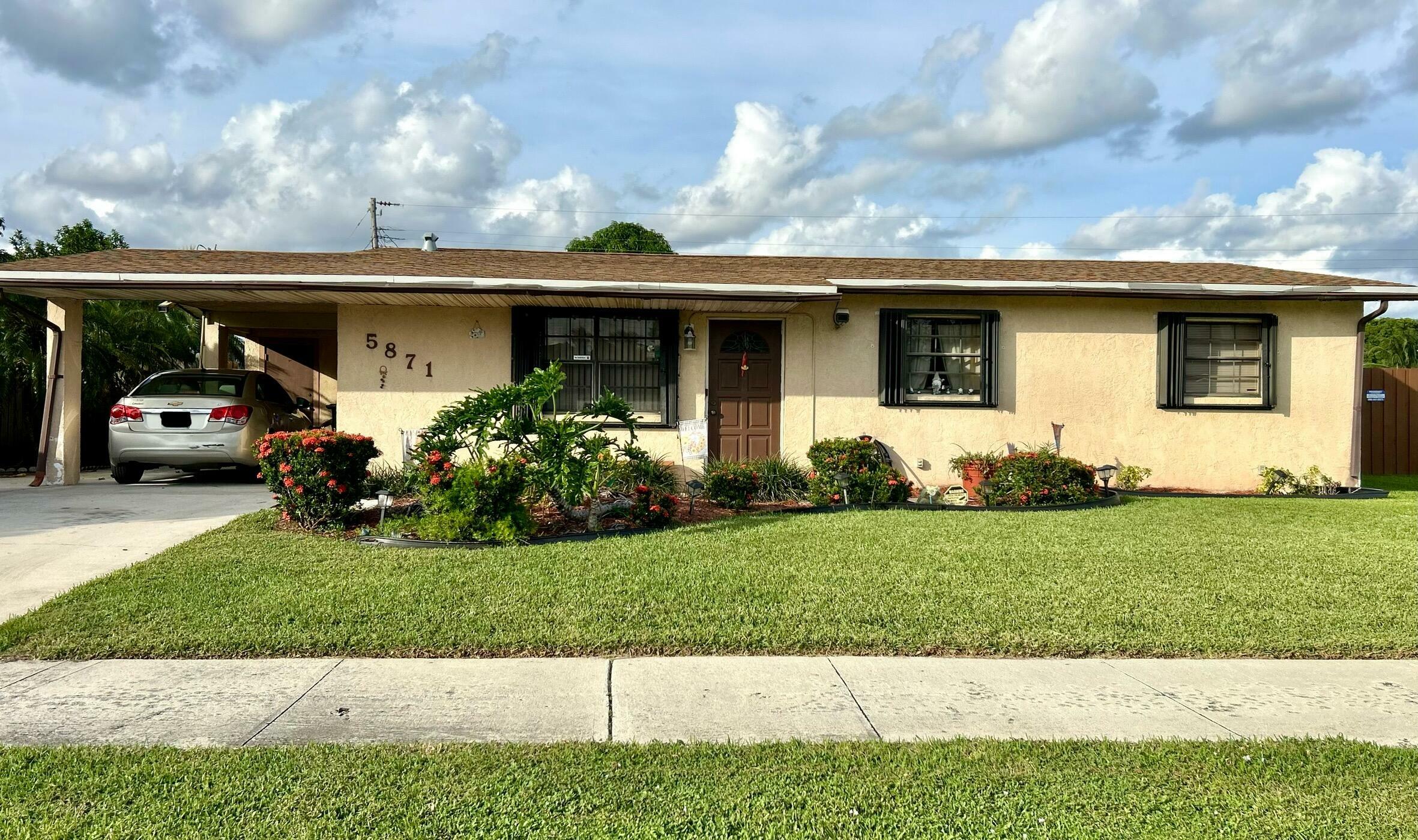 Property Photo:  5871 Purdy Lane  FL 33415 