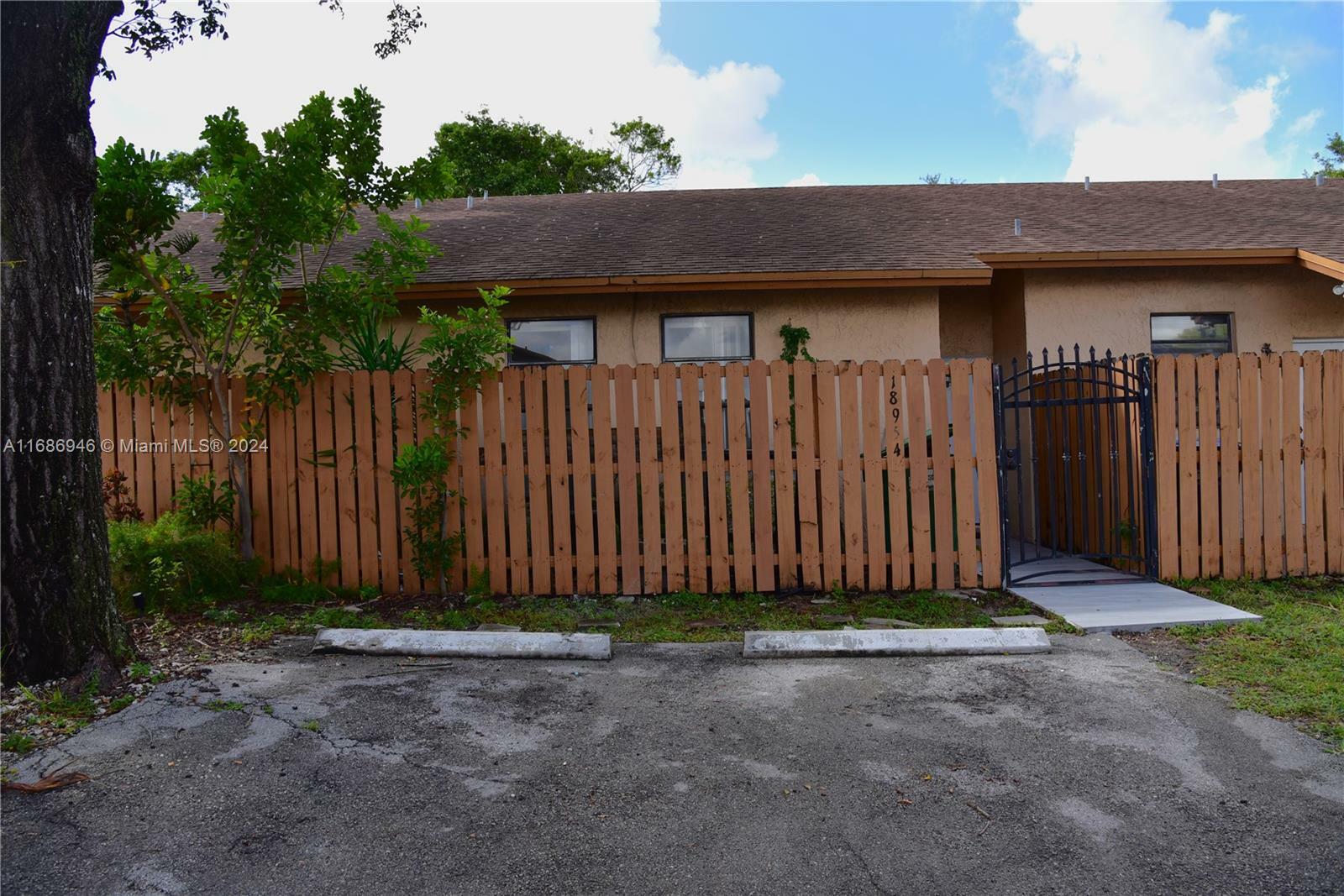 Property Photo:  18954 NW 67th Pl 18954  FL 33015 