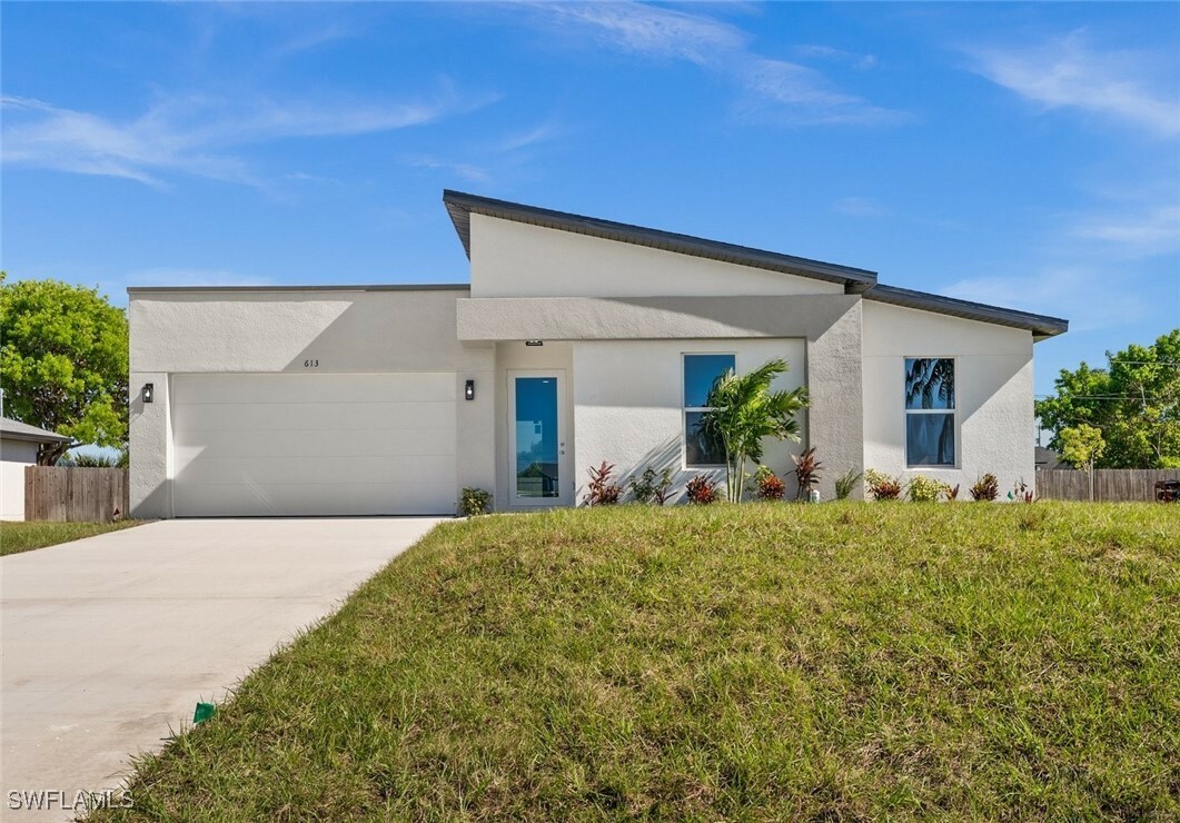 Property Photo:  613 NW 17th Avenue  FL 33993 