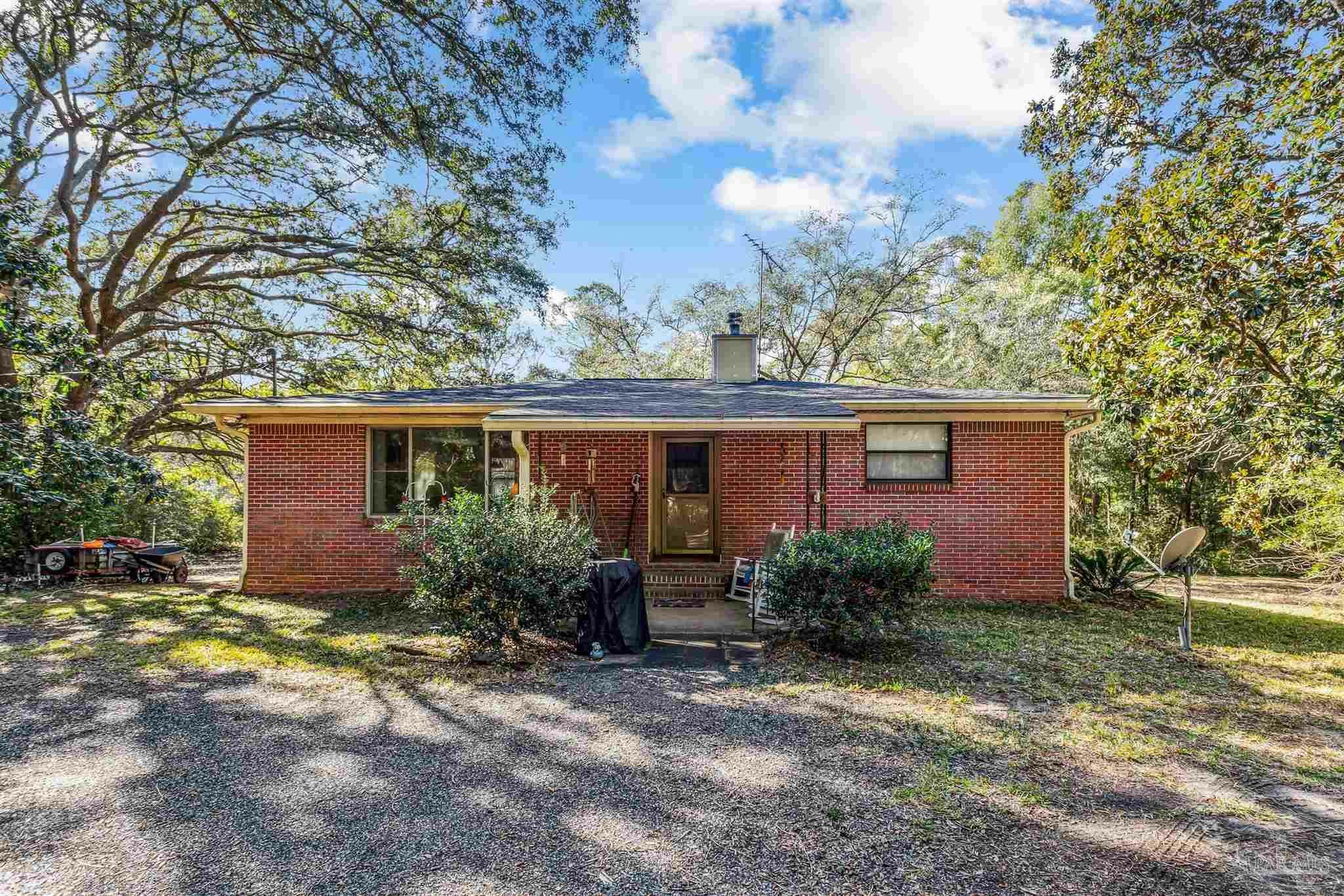 Property Photo:  7665 Lund Rd  FL 32570 