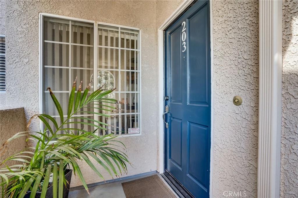 Property Photo:  4571 Warner Avenue 203  CA 92649 