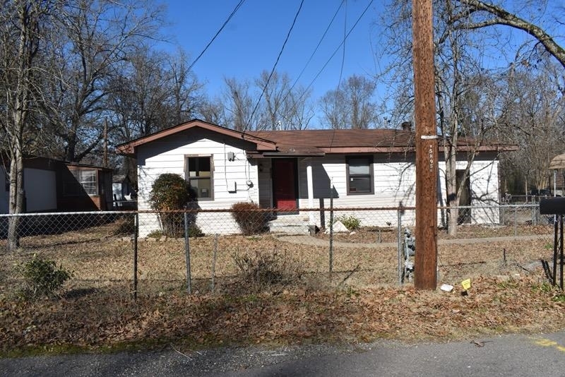 Property Photo:  5801,05,07 Womack  AR 71601 