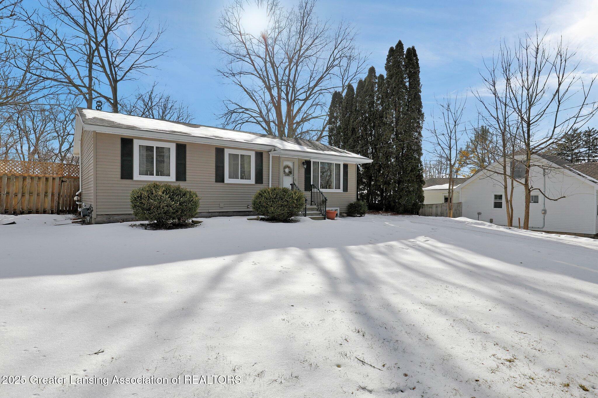 Property Photo:  5815 Lake Drive  MI 48840 