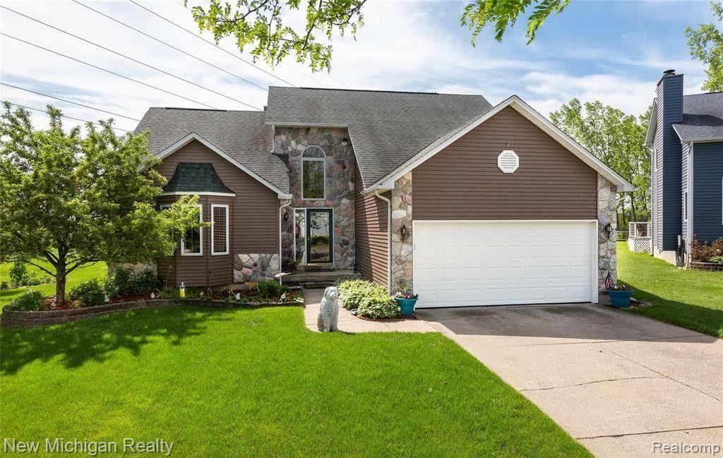 Property Photo: 834 Peppermill Circle MI 48446 2678