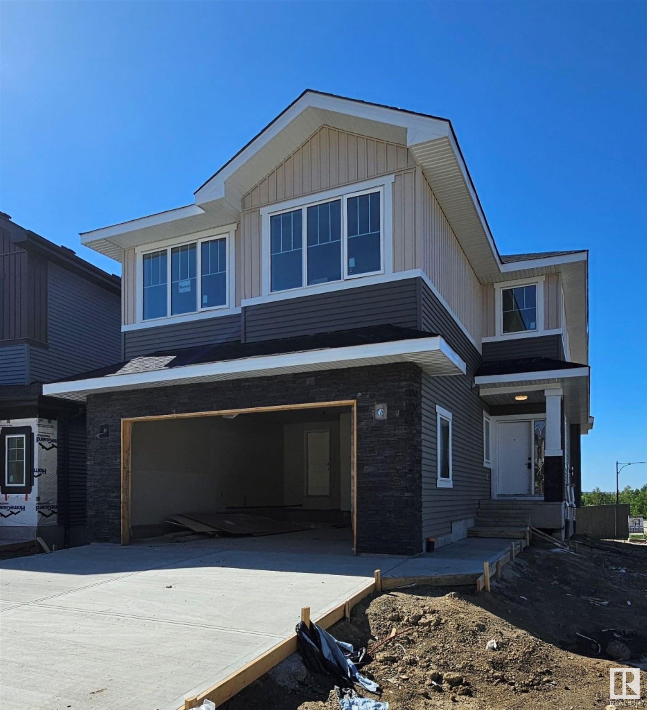 Property Photo:  1135 Gyrfalcon Crescent NW  AB T5S 0S5 