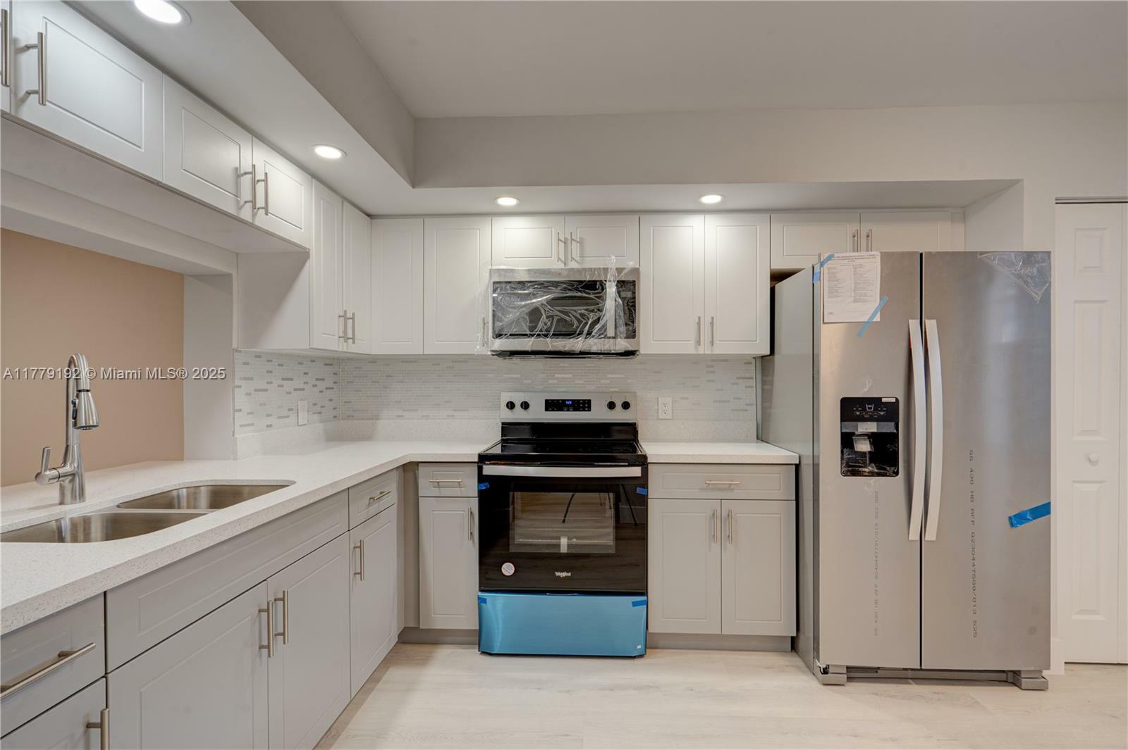 Property Photo: 1101 SW 128th Ter 310C FL 33027