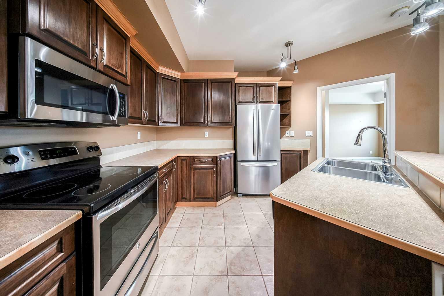 Property Photo: 5040 53 Street 207 AB T4S 0A1