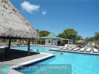 Property Photo: 608 SW Natura Blvd 105 FL 33441