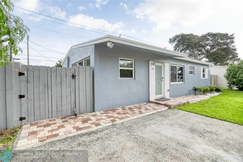 Property Photo: 1437 NE 25th St FL 33064