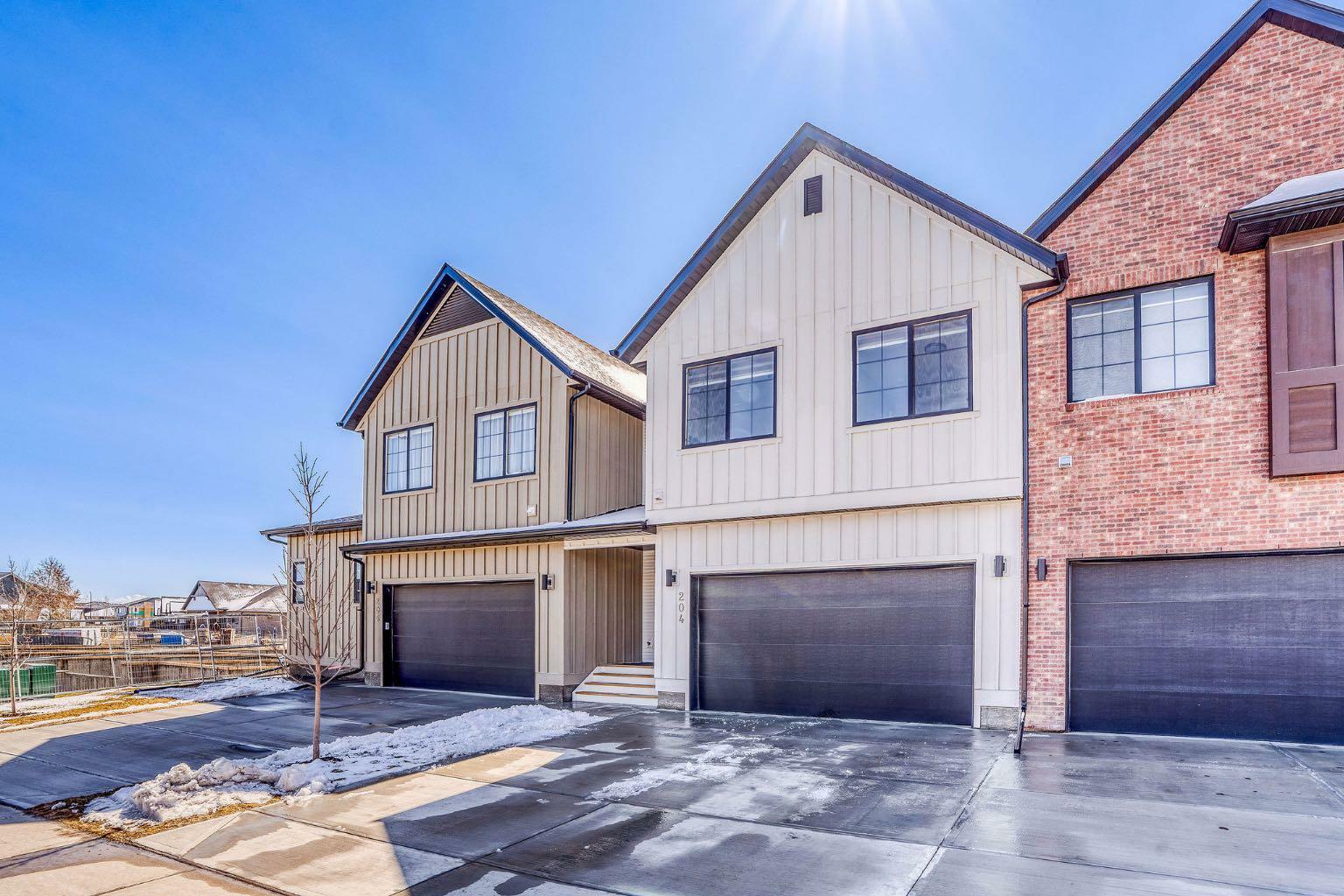 Property Photo: 201 Cooperswood Green SW 204 AB T3B 3Y6