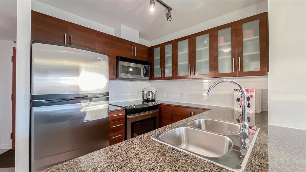 Property Photo:  833 Agnes Street 1208  BC V3M 0B1 