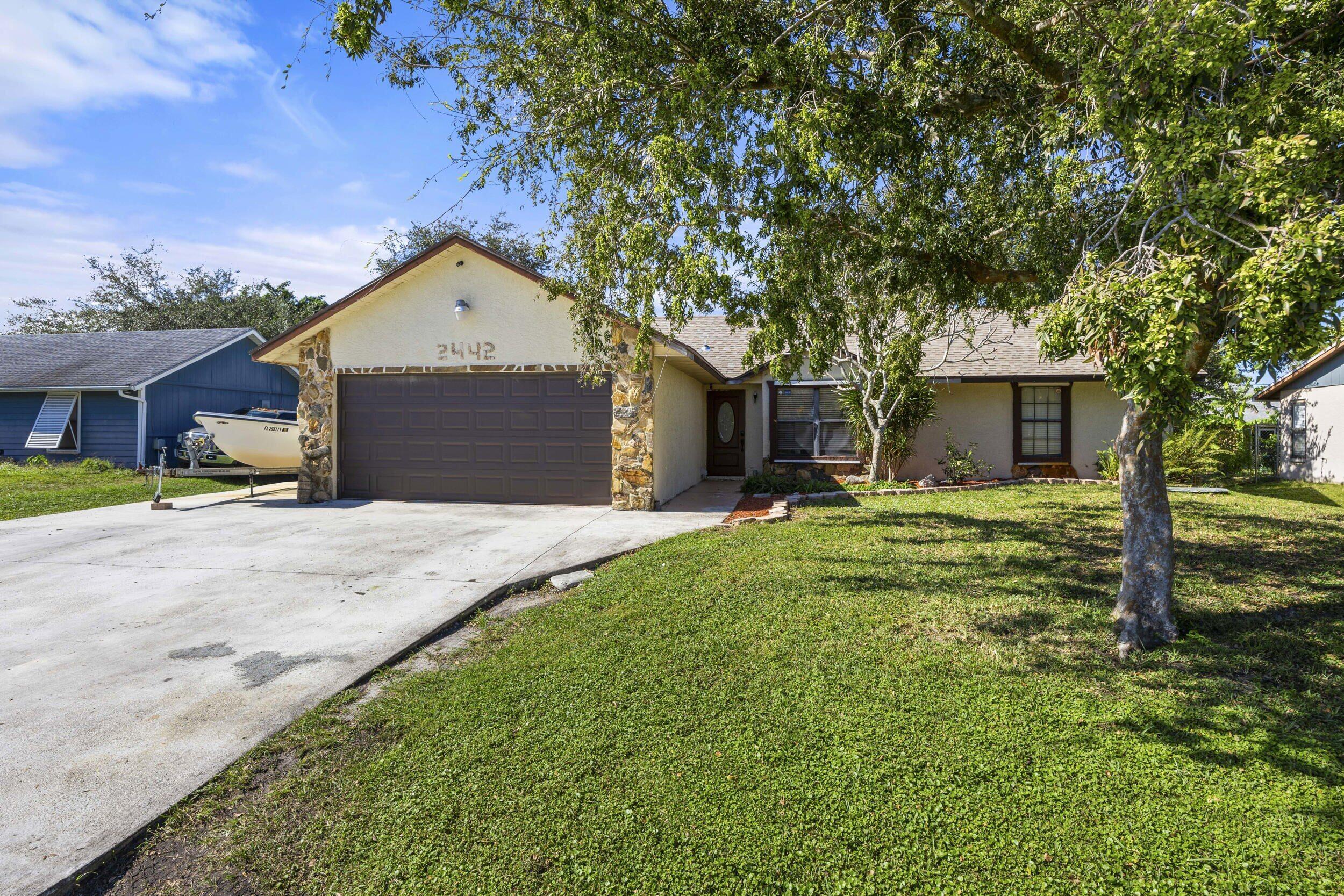 Property Photo: 2442 SW Lafayette Street FL 34984