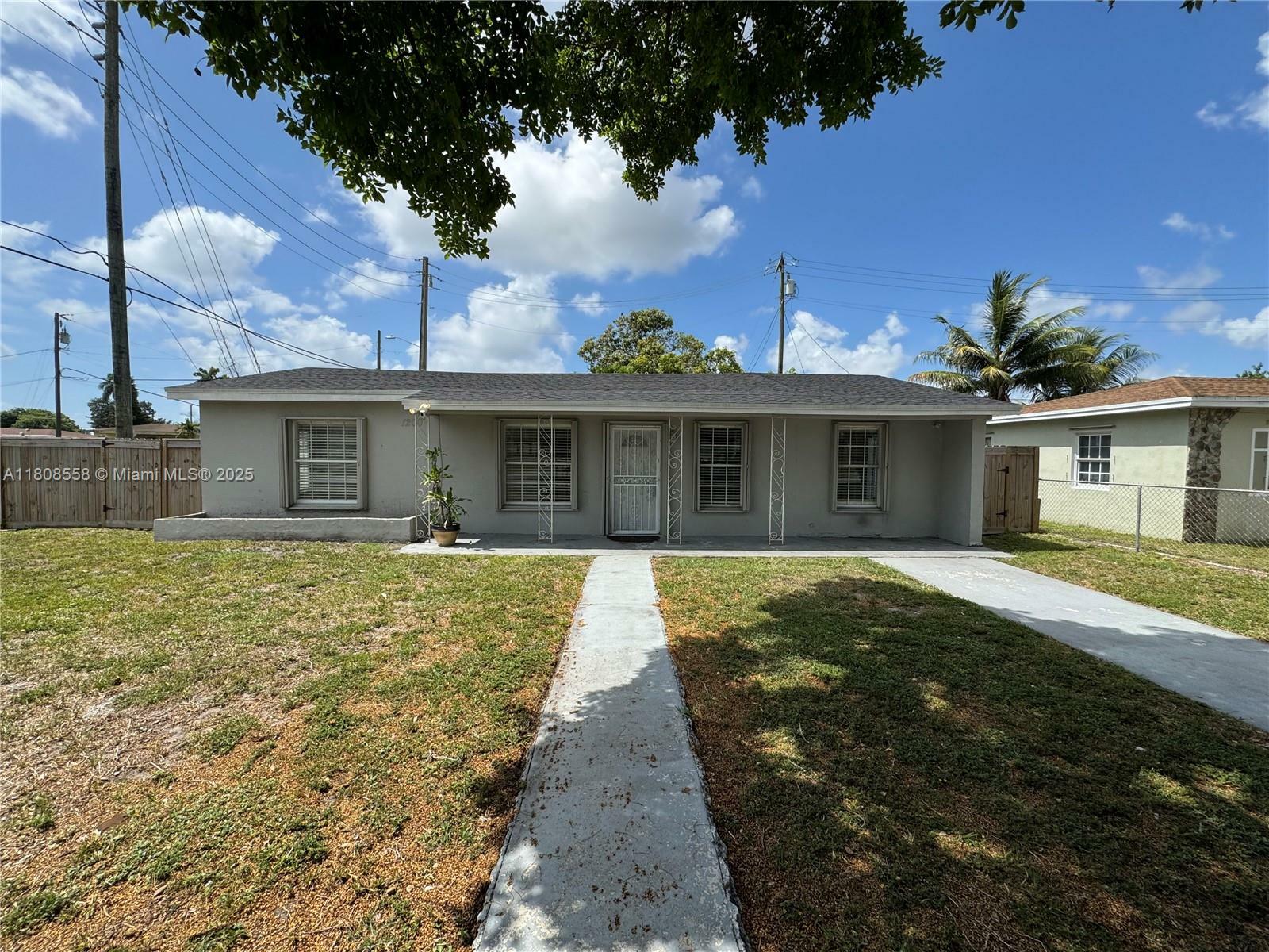 Property Photo: 1200 NW 87th St FL 33147