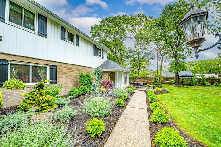 Property Photo:  1A Revlon Court  NY 11742 