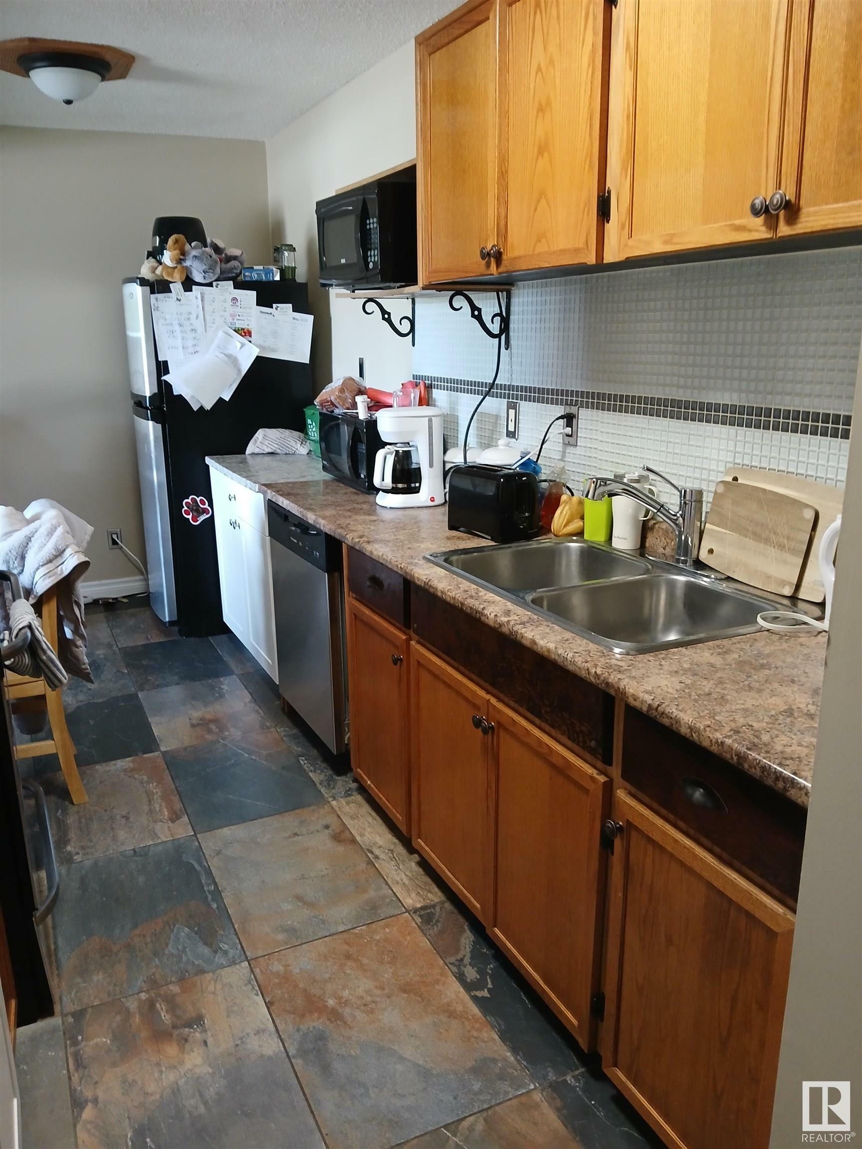 Property Photo: 6307 118 Avenue NW 207 AB T5W 1G2