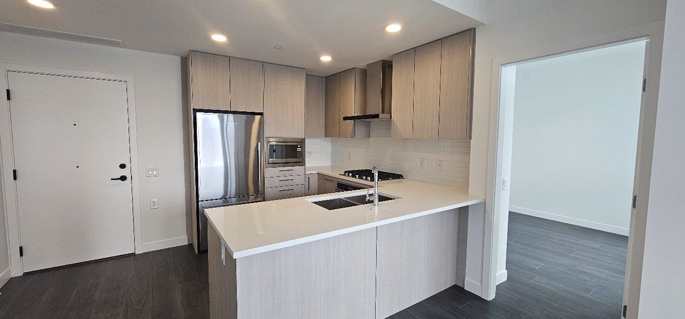 Property Photo:  518 Clarke Road 1902  BC V3J 0S7 