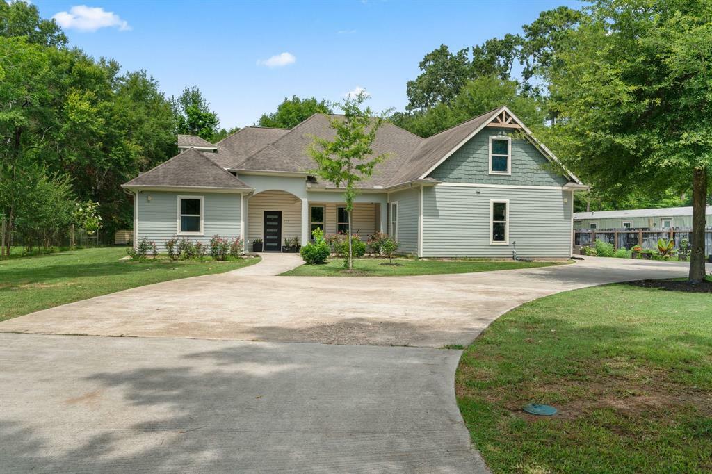 Property Photo: 210 County Road 3311 TX 77327