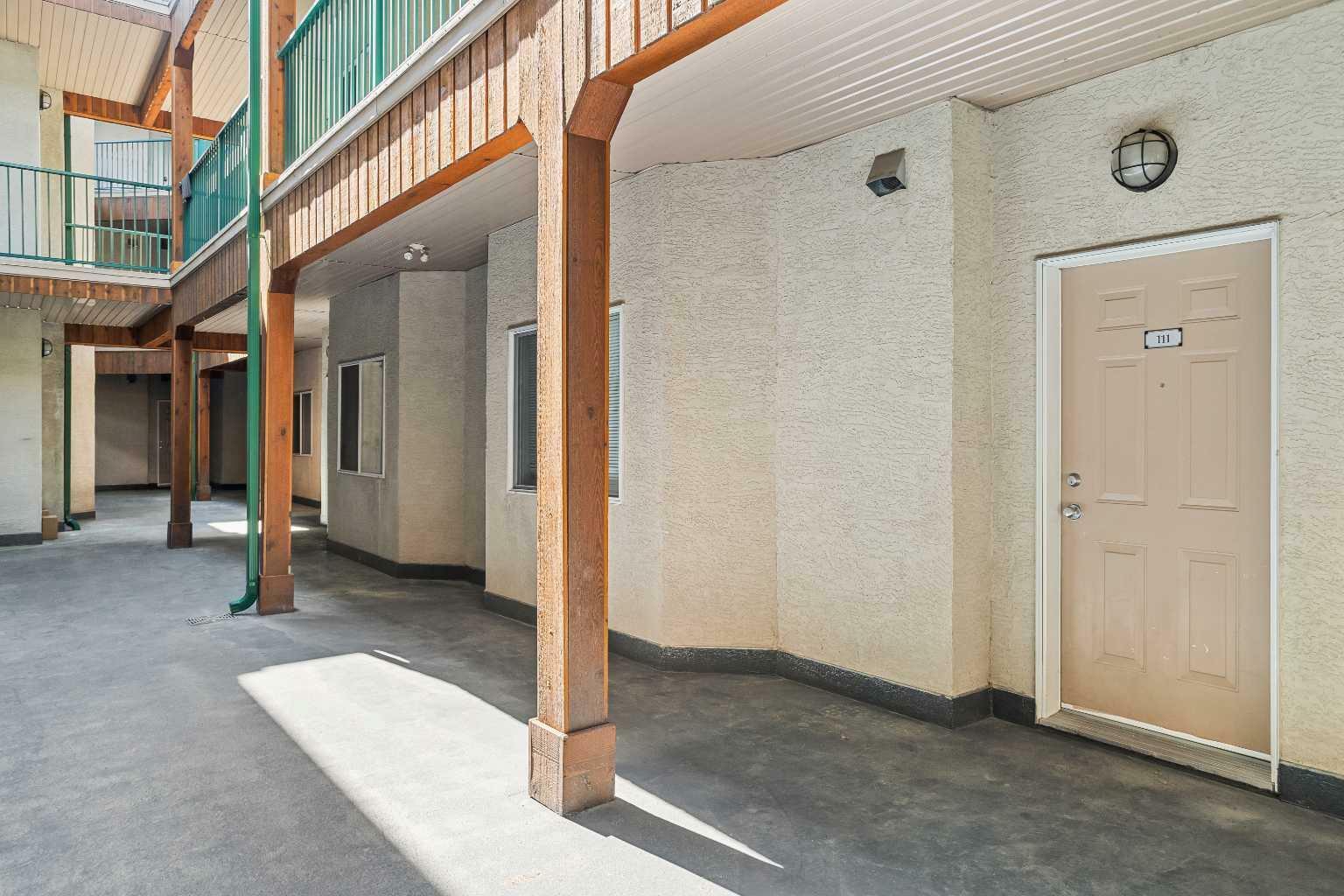Property Photo: 176 Kananaskis Way 111 AB T1W 3E4