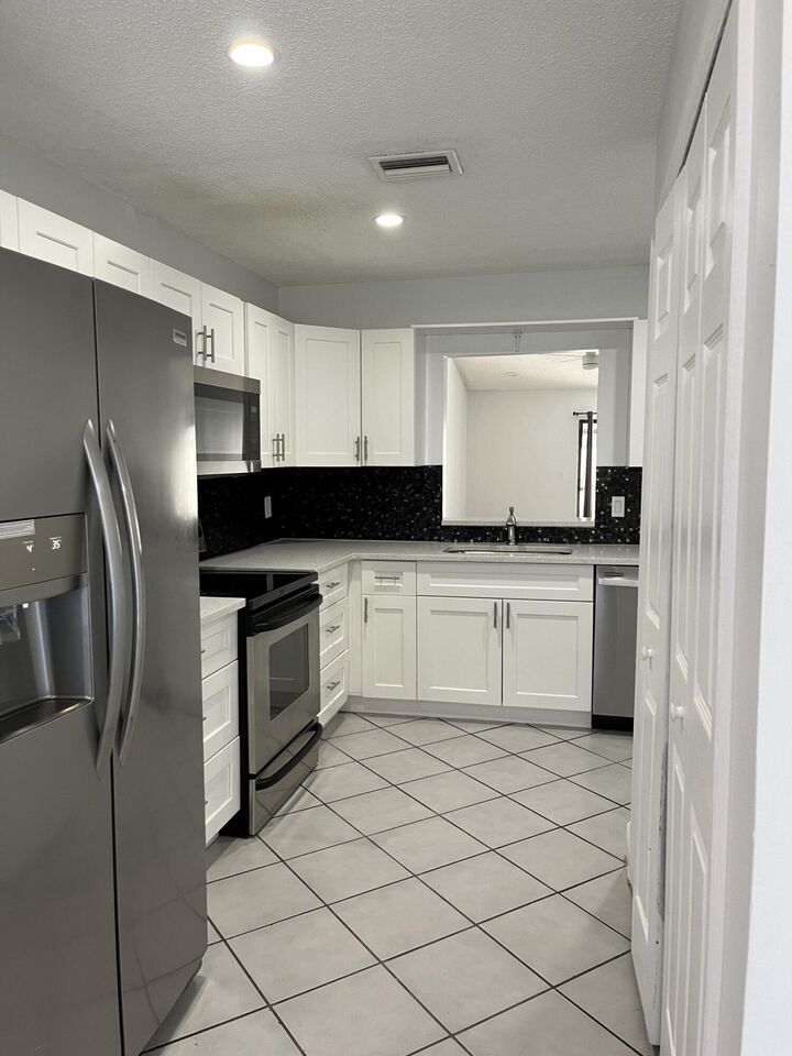 Property Photo: 1296 White Pine Drive FL 33414