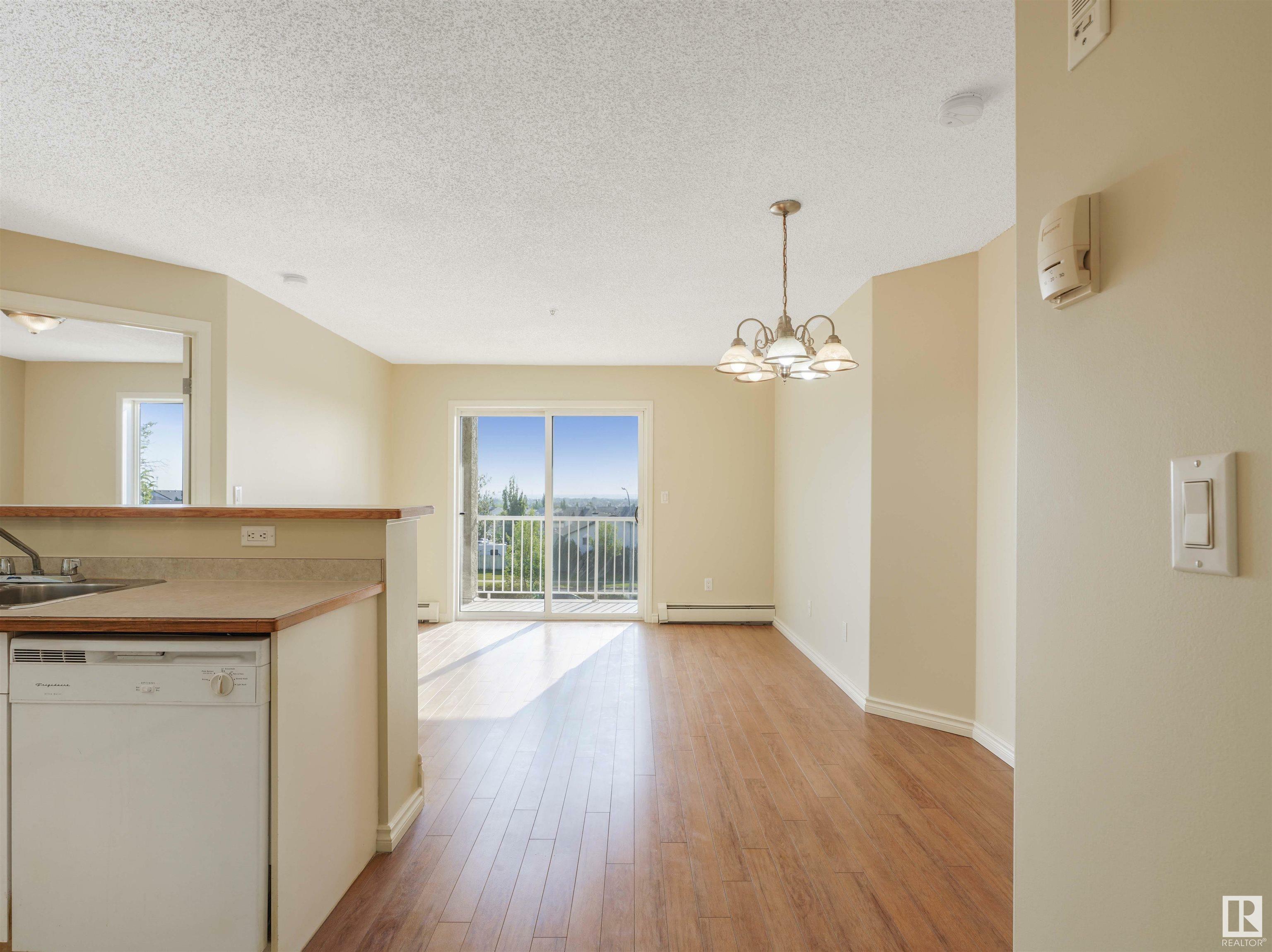 Property Photo: 14708 50 Street NW 319 AB T5A 5G9