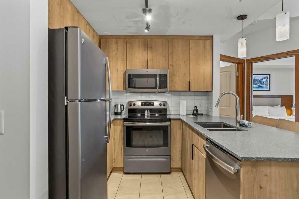 Property Photo: 190 Kananaskis Way 109 AB T1W 3K5